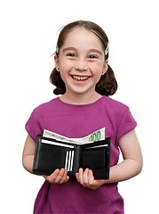 Image showing Smiling seven years girl with pigtails holds a wallet with money isolated 