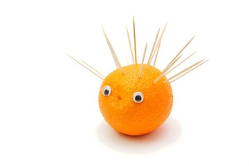 Image showing Funny hedgehog made of orange fruit and toothpicks isolated