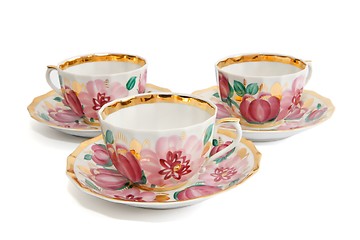 Image showing Three tea cups with saucers isolated 