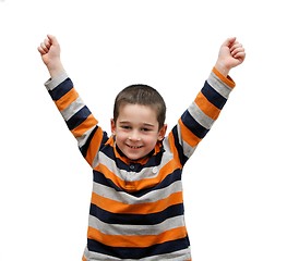 Image showing Cute little boy rises his arms in a V-sign isolated