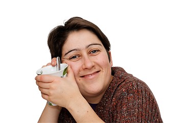 Image showing Smiling mid age woman holding a cup isolated