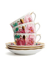 Image showing Stack of three porcelain tea cups with saucers isolated 
