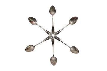 Image showing Six-pointed star made of engraved silver spoons isolated