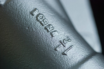 Image showing Close-up of pipe with text
