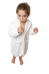 Image showing Girl brushing her teeth with toothbrush