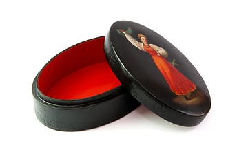 Image showing Oval black casket painted with dancing female peasant isolated