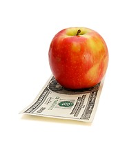 Image showing Red apple on twenty dollar bill isolated