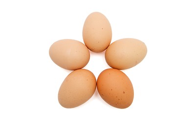 Image showing Five-pointed star of five brown eggs isolated