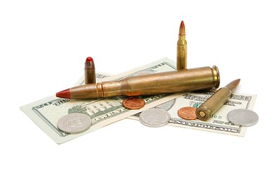 Image showing American banknotes, coins and cartridges isolated