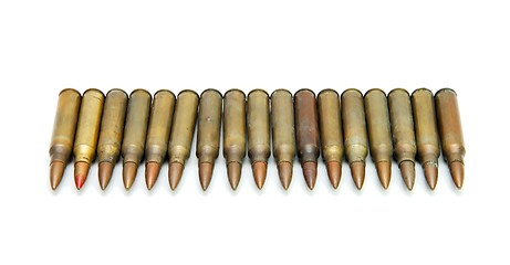 Image showing Row of 5.56mm M16 assault rifle cartridges isolated