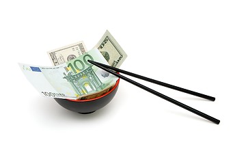 Image showing Money in red and black oriental bowl  with chopsticks isolated