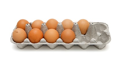 Image showing Nine brown eggs in a paper box isolated