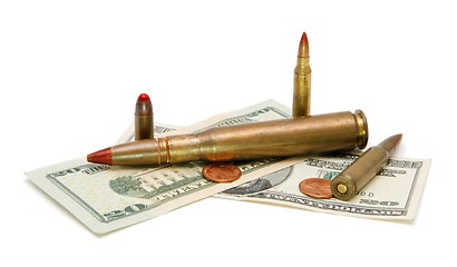 Image showing American banknotes, coins and cartridges isolated