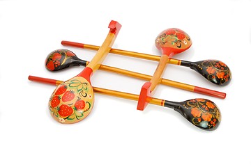 Image showing Five Russian wooden painted spoons crossed isolated