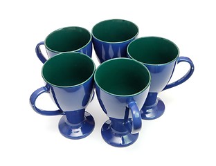 Image showing Circle of five blue coffee cups with handles out isolated