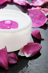 Image showing Pink flower petal and water bowl decoration.