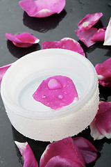 Image showing Pink flower petal and water bowl decoration.