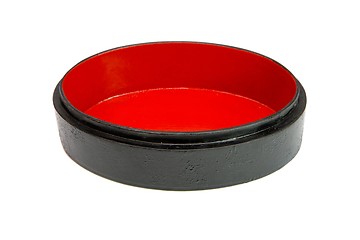 Image showing Oval black wooden casket with red lining isolated