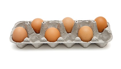 Image showing Six brown eggs in a paper box in chess order isolated