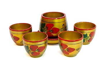 Image showing Russian painted wooden honey pot with four cups  isolated