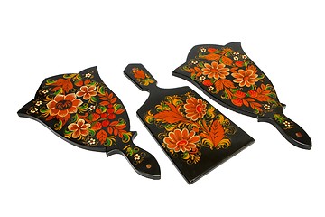 Image showing Three Russian black cutting board painted with flowers isolated