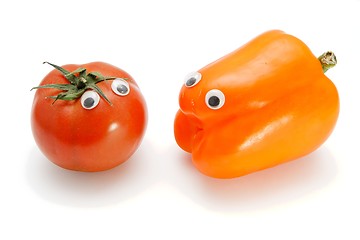 Image showing Red tomato and orange bellpepper with eyes  isolated