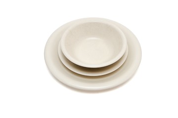 Image showing Plain beige dinner plate, soup plate and  saucer isolated