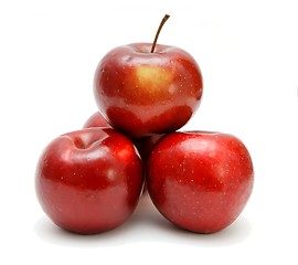 Image showing Four red apples in a pyramid isolated 