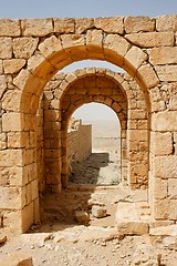 Image showing Converging ancient stone arches 