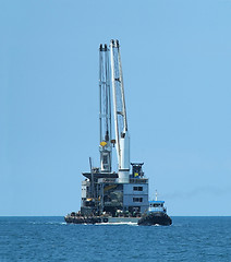 Image showing Tugboat and floating cranes