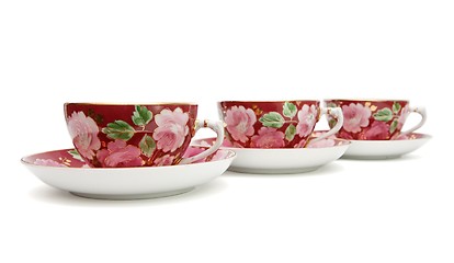 Image showing Three tea cups with saucers  isolated