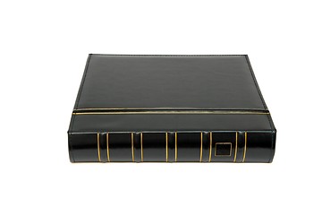 Image showing Thick black book laid isolated