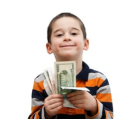 Image showing Cute little boy holds a fan of banknotes isolated