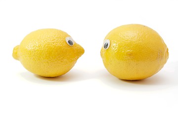Image showing Two funny lemon fruits with eyes isolated
