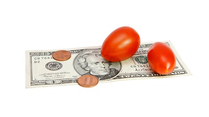 Image showing Small tomatoes on twenty dollar bill and cents isolated