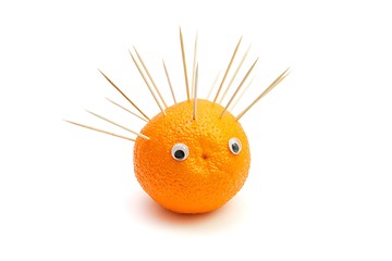Image showing Funny hedgehog made of orange fruit and toothpicks  isolated