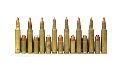 Image showing Row of alternating M16 assault rifle and 9mm Parabellum cartridges isolated