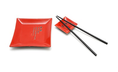 Image showing Chopsticks, red square plate and saucer isolated