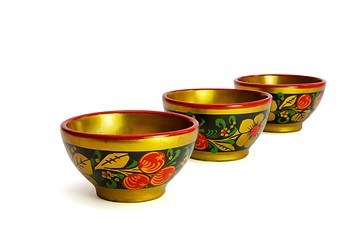 Image showing Three painted Russian wooden cups isolated