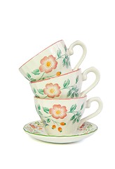 Image showing Stack of three porcelain tea cups isolated 