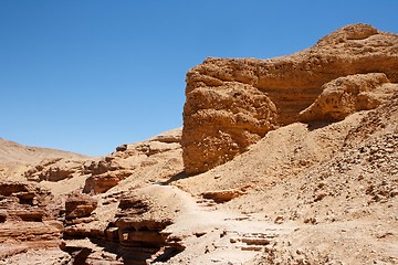 Image showing Red eroded rocks in stony desert