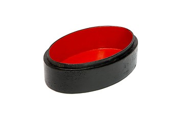 Image showing Open empty oval black casket with red lining isolated