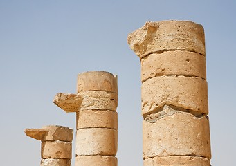 Image showing Three broken column tops of ancient temple