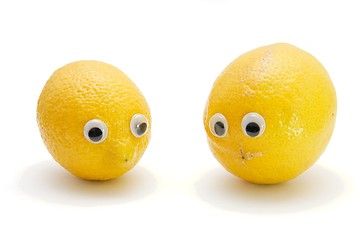 Image showing Two funny lemon fruits with eyes