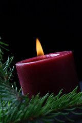 Image showing Candle and birch branch in the dark.