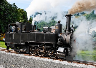 Image showing Historical steam engine on tracks