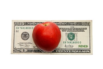 Image showing Red nectarine peach on twenty dollar bill isolated