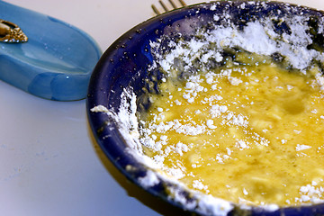 Image showing Flour and Egg on a blue bowL