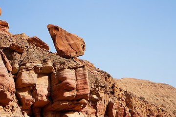 Image showing Picturesque unstable red rock in stone desert