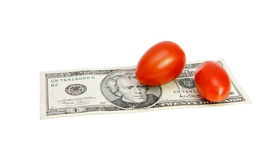 Image showing Small tomatoes on twenty dollar banknote isolated